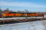BNSF 5839 and BNSF 6142 with Jordan Spreader BN 972674 work a plow extra